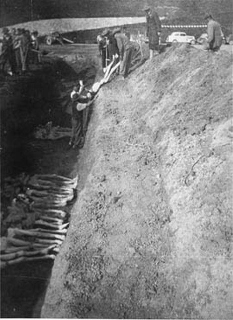 Civilians burying the dead